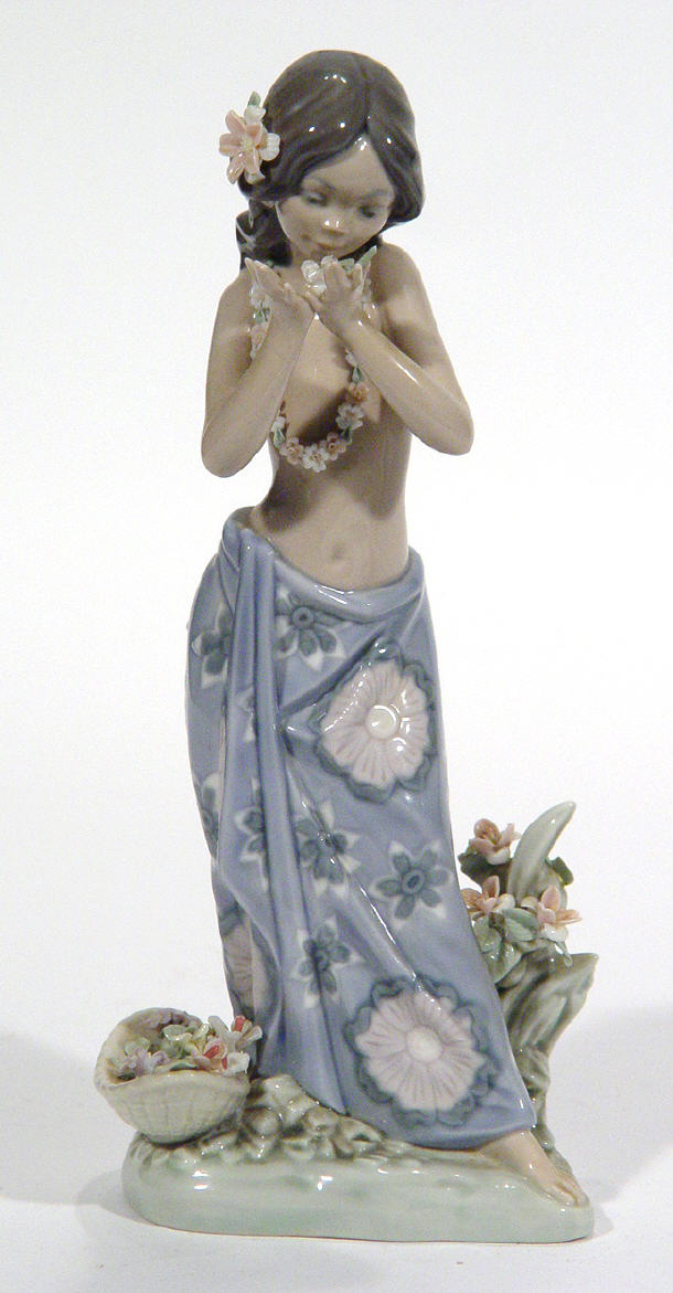 Appraisal: Hand painted Lladro Hawaiian girl figurine in a sarong beside