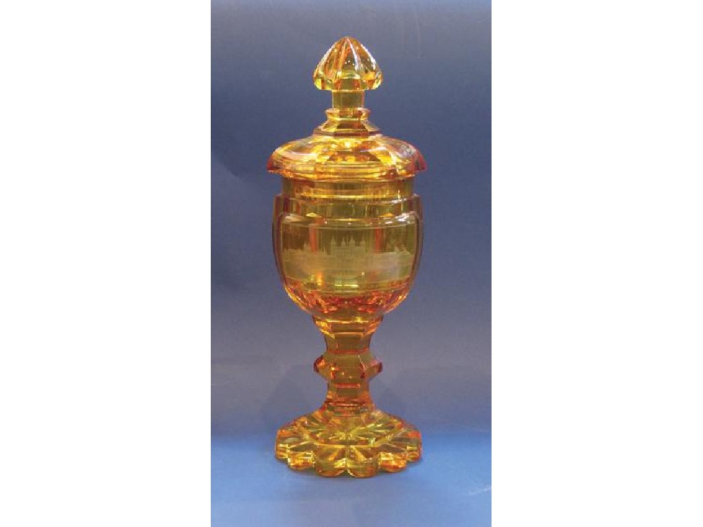 Appraisal: A BOHEMIAN AMBER-GLASS LIDDED GOBLET of hexagonal panelled form the