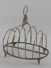 Appraisal: An oval six slice Georgian silver toast rack on baluster