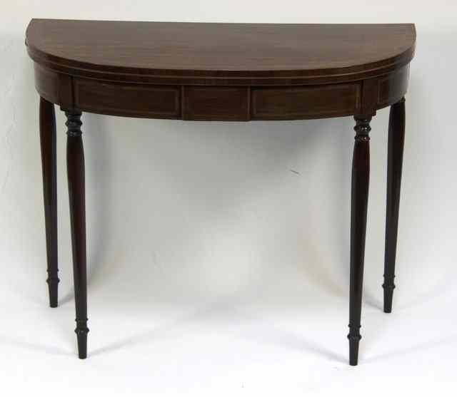 Appraisal: A George III mahogany D-shaped tea table with crossbanded top