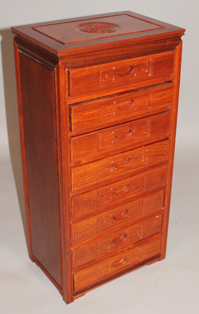 Appraisal: A Chinese hardwood specimen or jewellery cabinet the rectangular outline