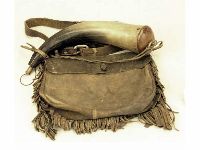 Appraisal: Fringed pig skin hunting bag with powder horn Estimate -