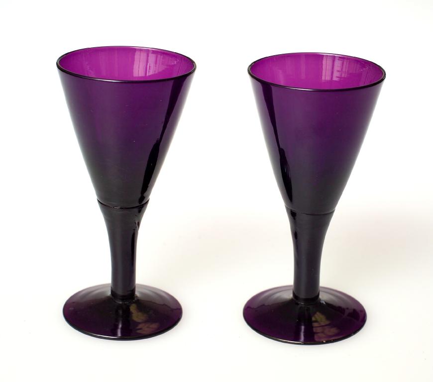 Appraisal: PAIR OF AMETHYST WINES th CENTURY each with funnel bowl