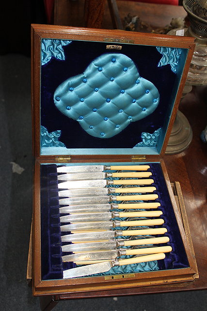 Appraisal: A VICTORIAN CASED SET OF DESSERT KNIVES FORKS with ivory