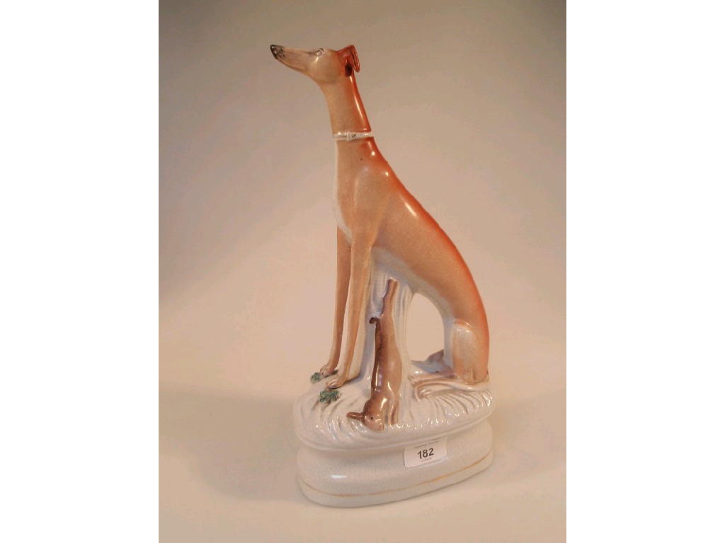 Appraisal: A Staffordshire figure of a seated greyhound with dead game