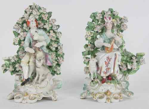 Appraisal: A pair of Chelsea Derby figures of musicians on rococo