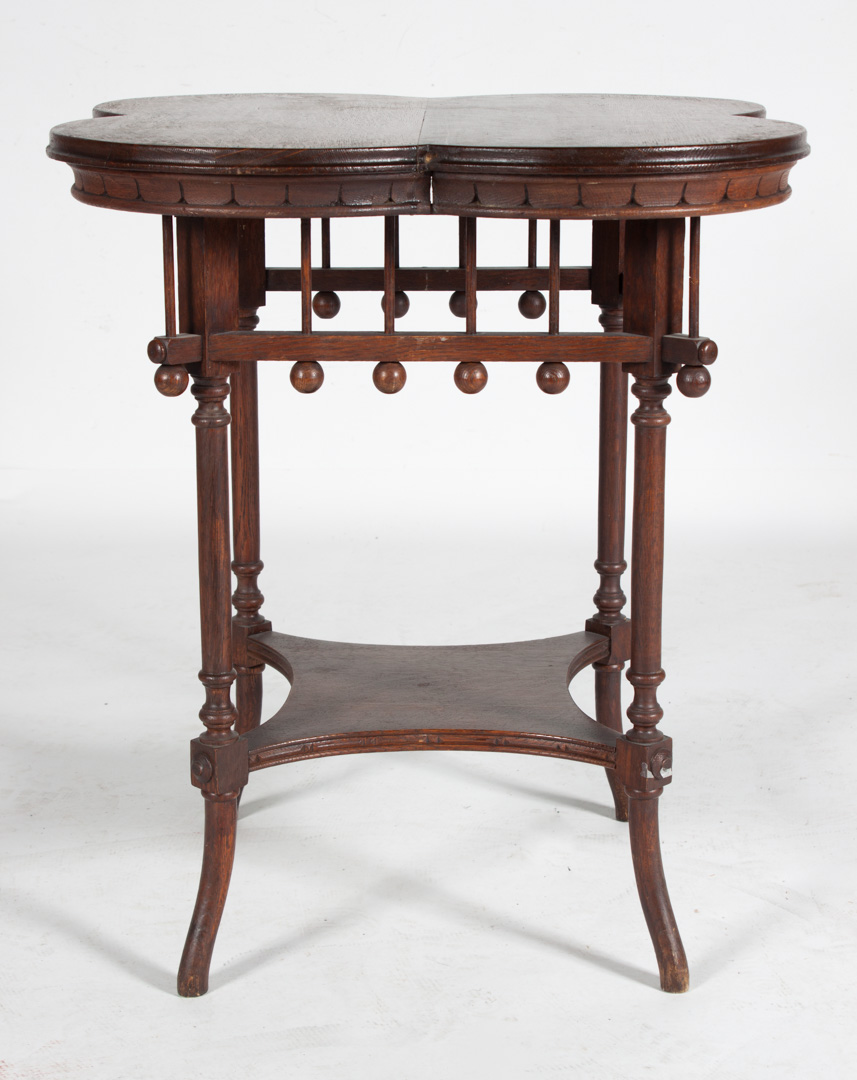 Appraisal: Late Victorian oak side table circa quatrefoil shaped top ball