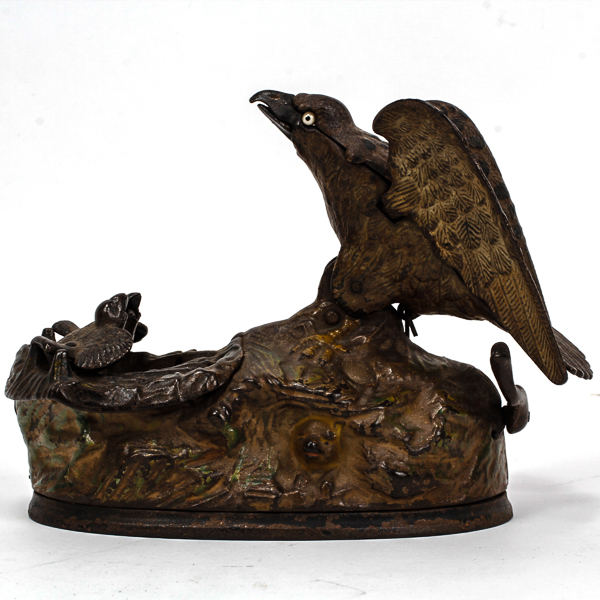 Appraisal: Eagle and Eaglets a cast iron mechanical bank by J