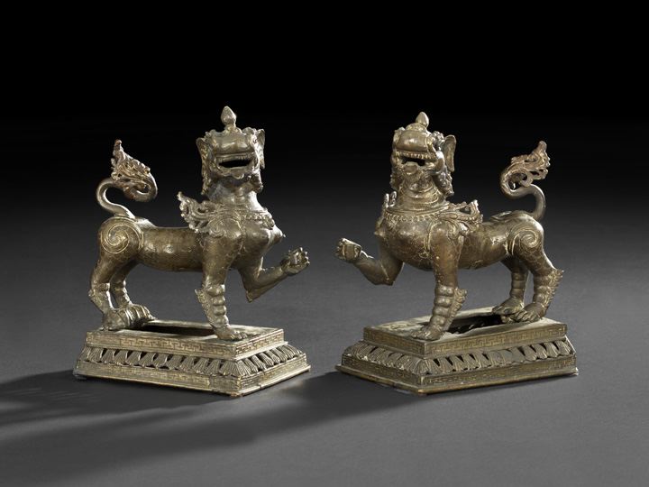 Appraisal: Pair of Thai Bronze Figures of Mythical Lions each standing