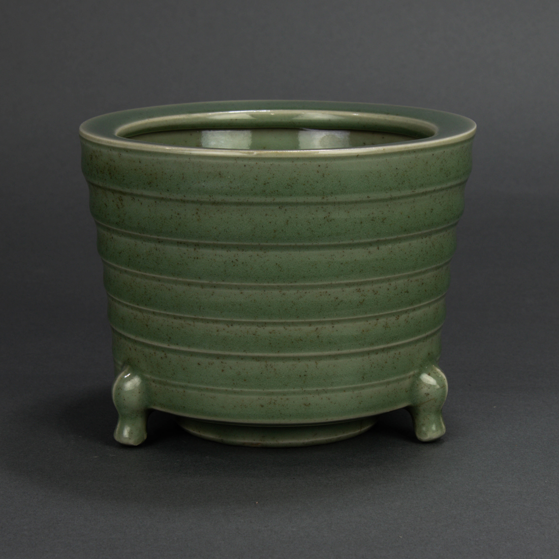 Appraisal: CHINESE LONGQUAN CELADON GLAZED TRIPOD CENSER Chinese Longquan celadon glazed