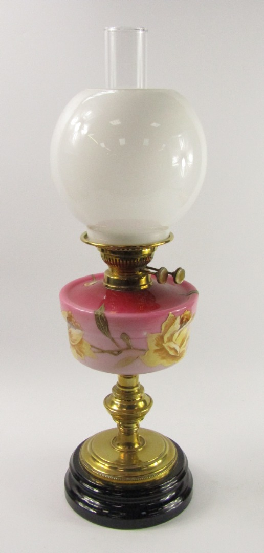 Appraisal: A late thC brass and pink opaline glass oil lamp