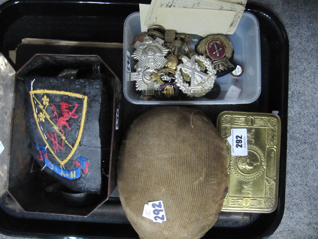 Appraisal: Lot comprising military badges water bottle Christmas tin patches etc