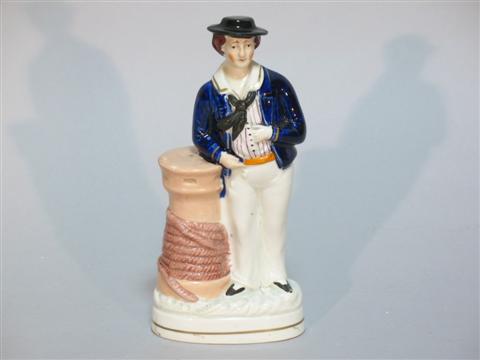 Appraisal: STAFFORDSHIRE FIGURINE OF A SAILOR The standing tar wearing a