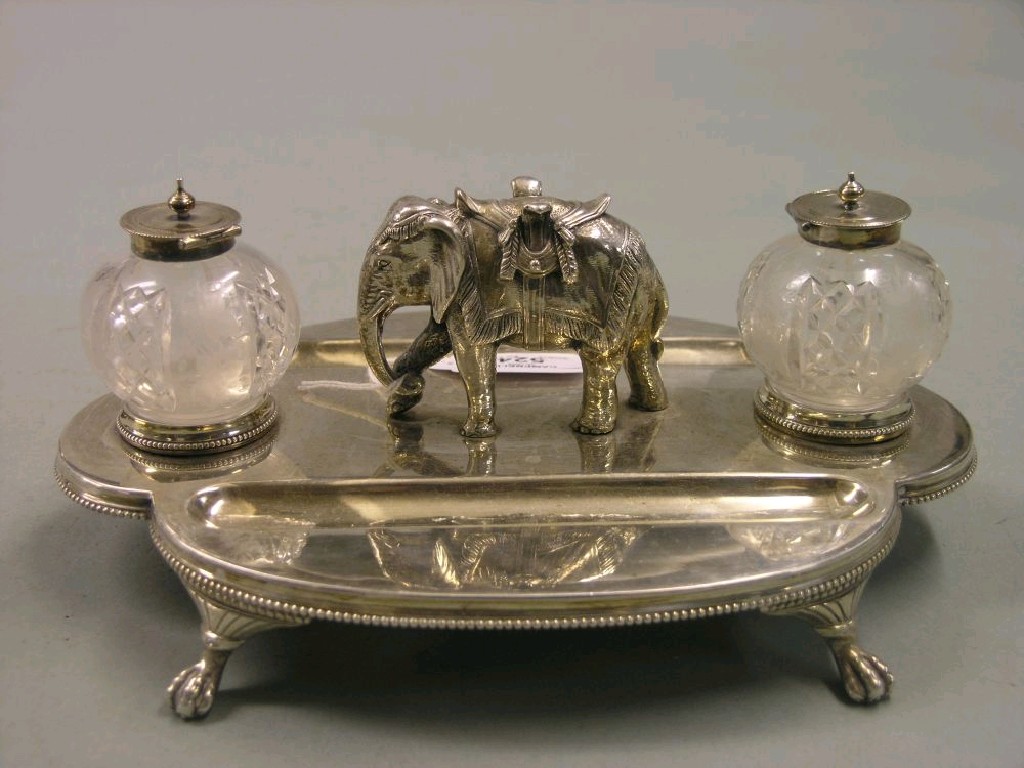 Appraisal: A silver plated desk stand with cast elephant surmount integral