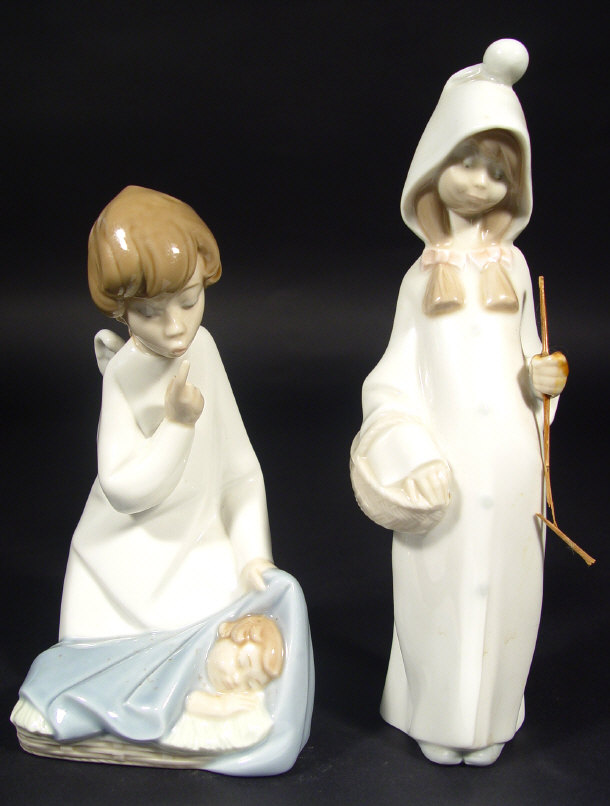 Appraisal: Two Lladro porcelain figures with hand painted decoration a girl