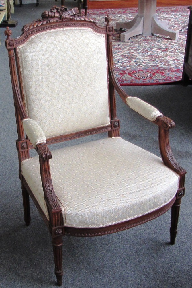 Appraisal: A pair of Louis XVI style beech framed fauteuils on