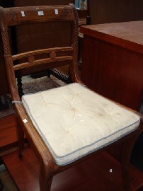 Appraisal: A th Century caned pine chair with beige upholstered cushion