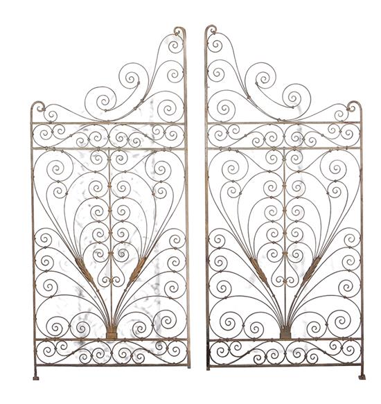 Appraisal: Pair wrought-iron gates early th century scrolling designs H W