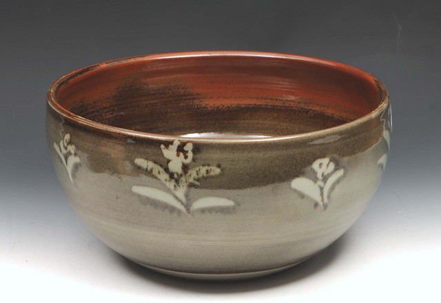 Appraisal: A WINCHCOMBE POTTERY BOWL with ash glaze and stylised floral