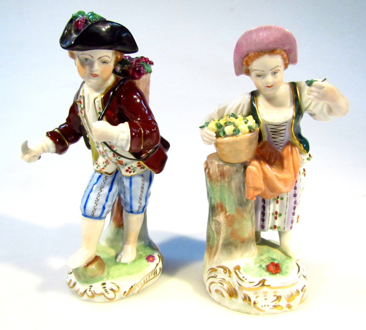 Appraisal: A Dresden porcelain figure of a child aside basket on