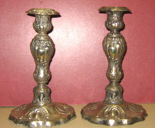 Appraisal: PAIR OF CONTINENTAL SILVER CANDLESTICKS Decorated with foliate and Rococo