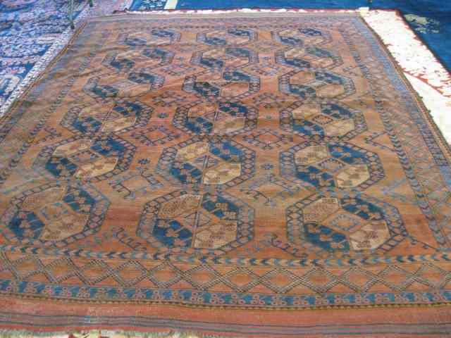 Appraisal: Persian Handmade Room Size Rug geometricdesigns on red-brown field '