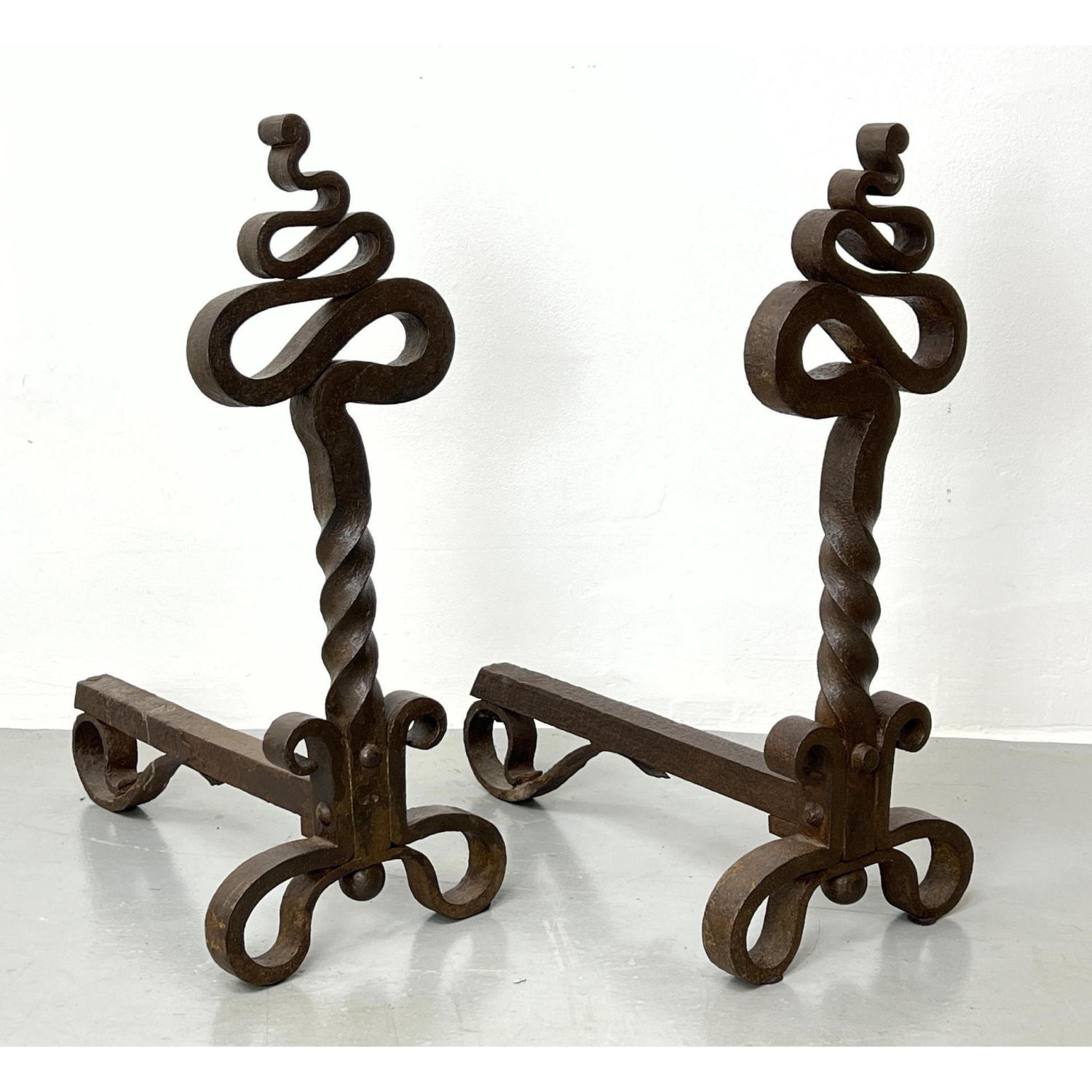 Appraisal: Pr Antique Twisted Wrought Iron Andirons Ribbon and twisted stem