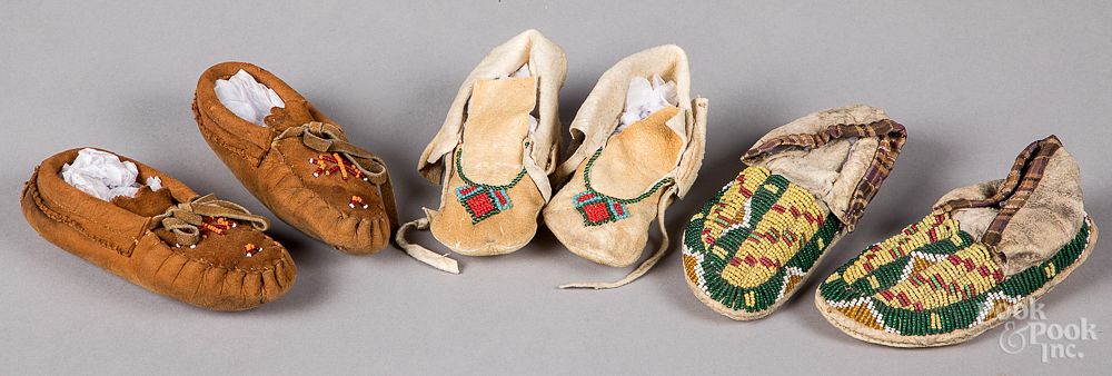 Appraisal: Three pairs of Native American Indian moccasins Three pairs of