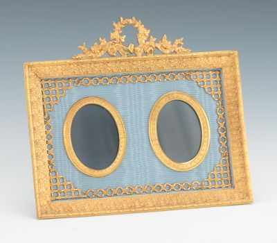 Appraisal: An Ormolu Double Picture Frame Delicate stand back picture frame