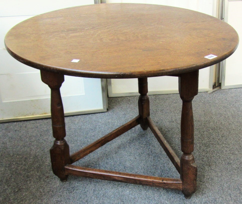 Appraisal: An th century style oak cricket table the circular top