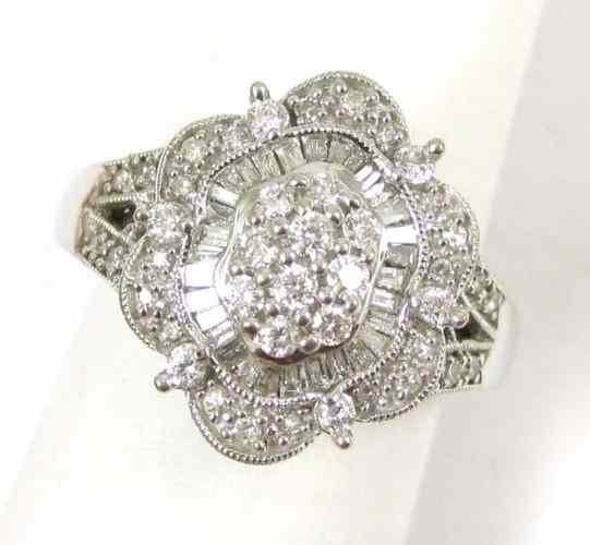 Appraisal: DIAMOND AND FOURTEEN KARAT WHITE GOLD RING set with round-cut