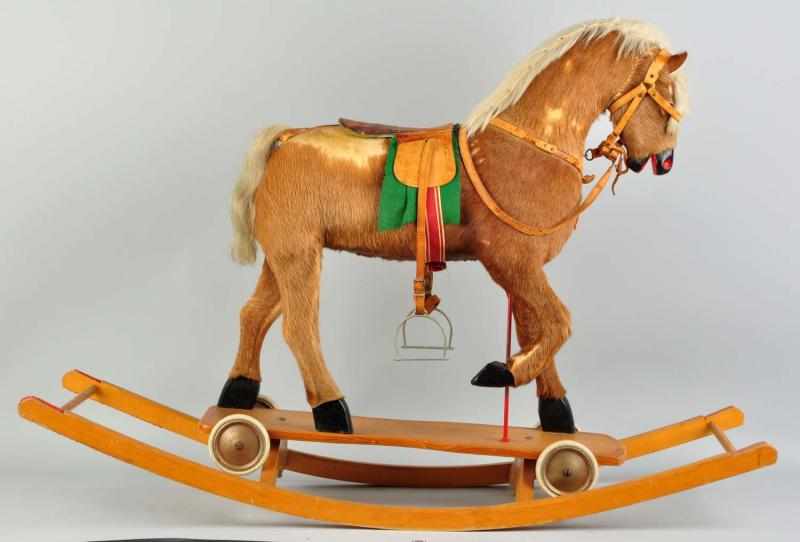 Appraisal: Large Hide-Covered Hobby Horse with Saddle Glass eyes Fur loss