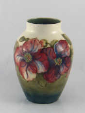 Appraisal: A Moorcroft anemone on green blue ground design vase Marks