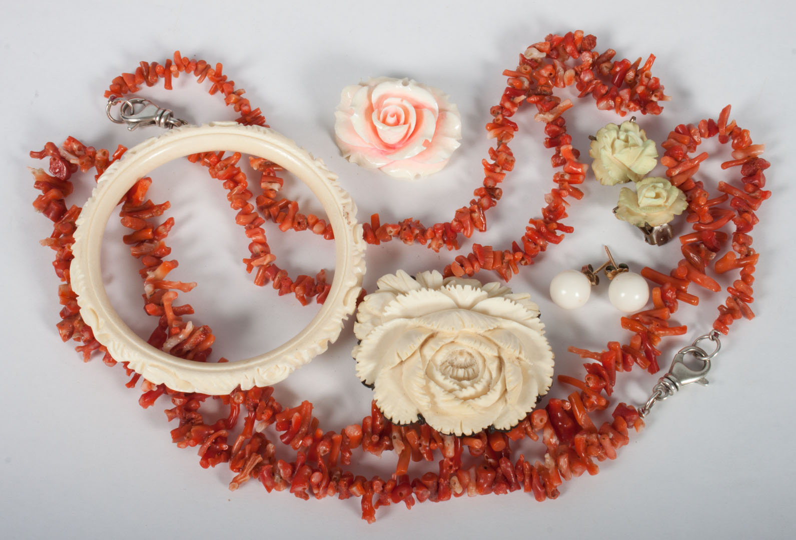 Appraisal: Group of coral and ivory jewelry items including two coral