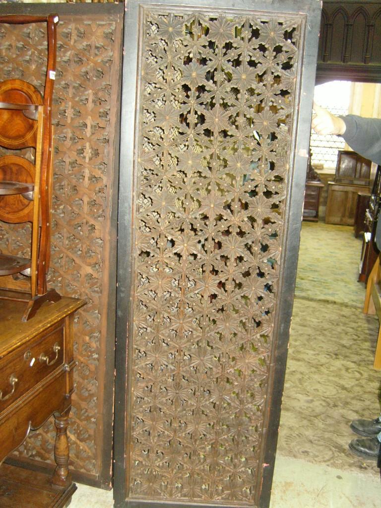 Appraisal: A set of four matching hardwood panels with pierced and