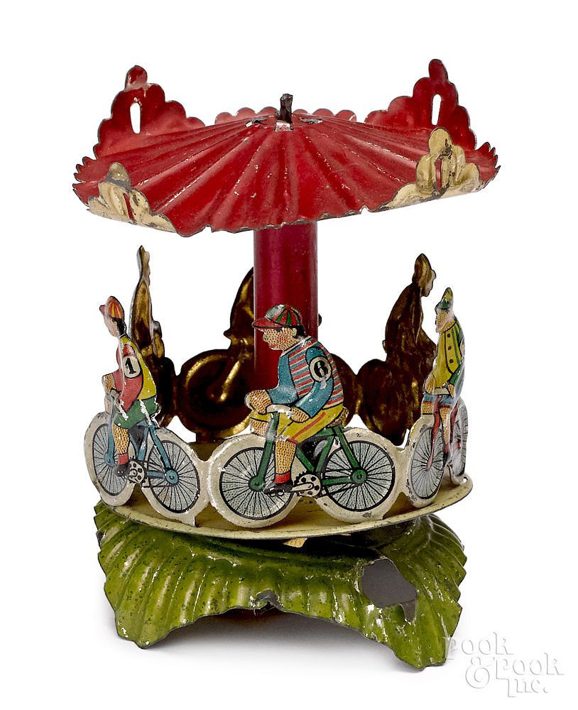 Appraisal: Meier tin lithograph bicycle carousel penny toy Meier tin lithograph