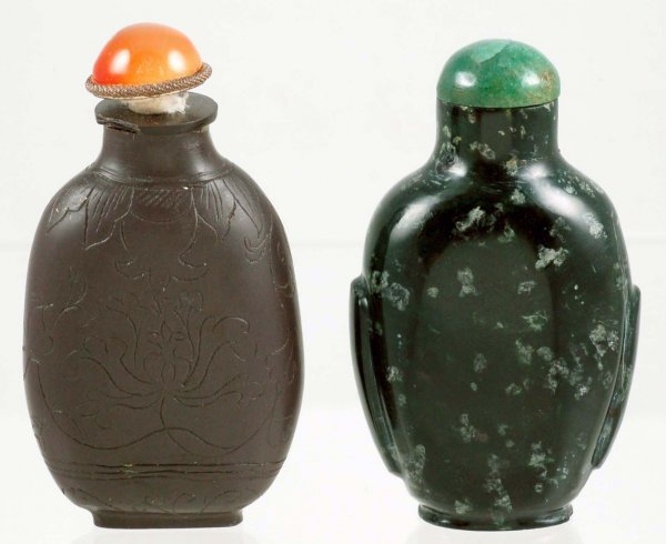 Appraisal: Two Chinese carved stone snuff bottles One - of black