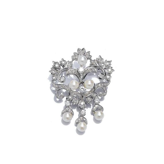 Appraisal: A DIAMOND AND PEARL BROOCH White gold Decorative pierced brooch