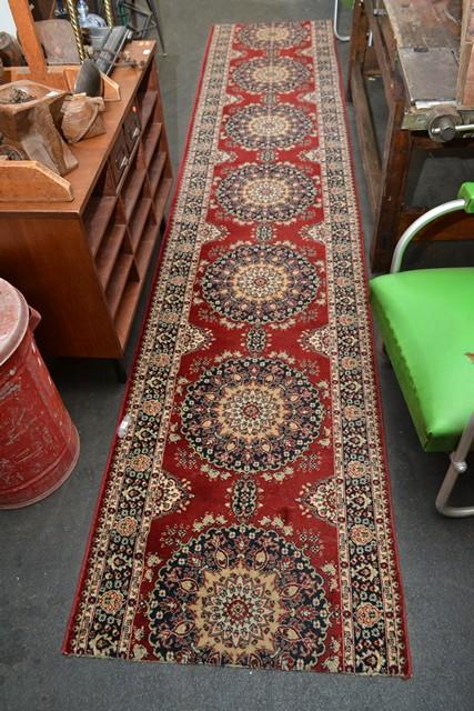 Appraisal: A PERSIAN STYLE RUNNER IN RED AND WHITE TONES A