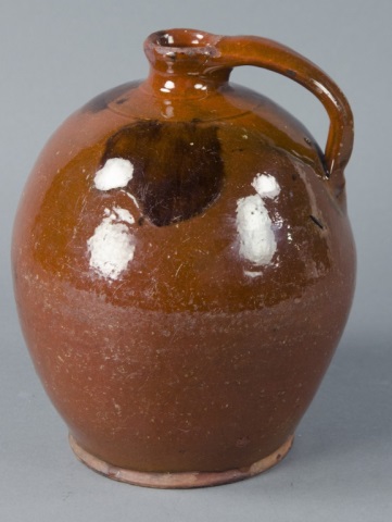 Appraisal: Ovoid Redware Jug with HandleWith lead glaze and a few