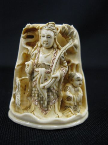 Appraisal: Carved Ivory Netsuke of Quan Yin holding a lotus blossom