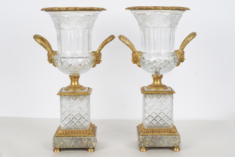 Appraisal: PAIR OF BACCARAT STYLE CUT CRYSTAL METAL-MOUNTED URNSfixed to marble