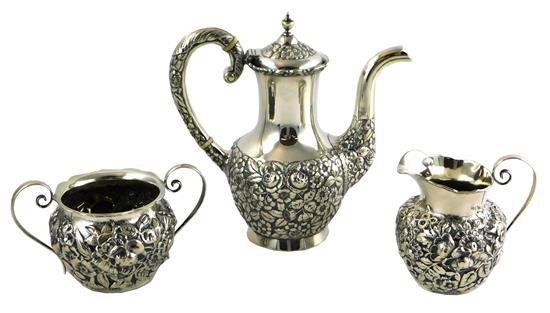 Appraisal: SILVER Assembled three piece tea service with ornate floral repousse