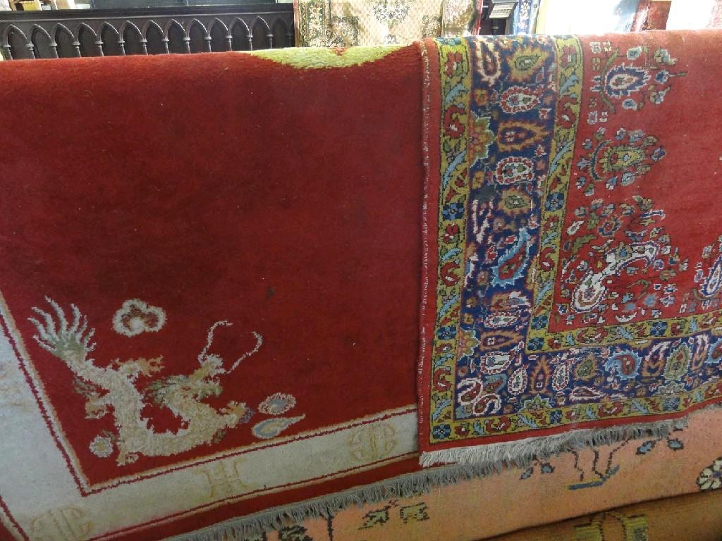 Appraisal: A Chinese rug with a central medallion on a red