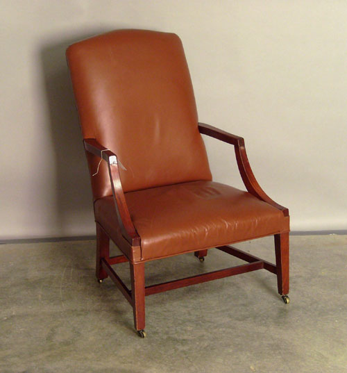 Appraisal: Mahogany open armchair with brown leather upholstery Provenance Collection of