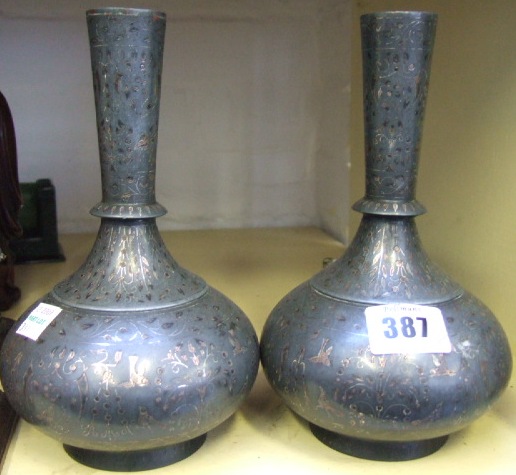 Appraisal: A pair of bidriware bottle vases incised with birds and