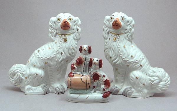 Appraisal: Three Staffordshire pottery spaniels second half th century Comprising pair