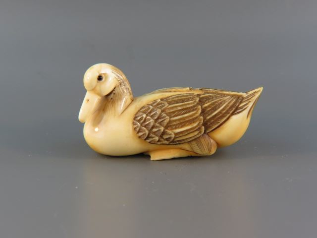 Appraisal: Carved Ivory Netsuke of a Duck fine polychrome wings black