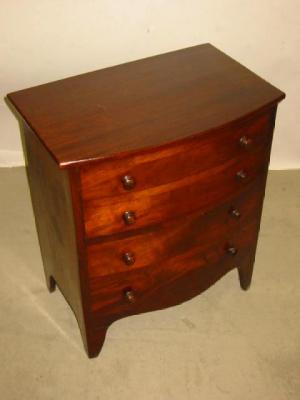 Appraisal: A MAHOGANY BEDSIDE COMMODE of bowed form the hinged lid