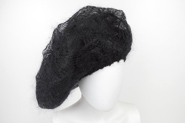 Appraisal: Two Alexander McQueen hats the first a black net and